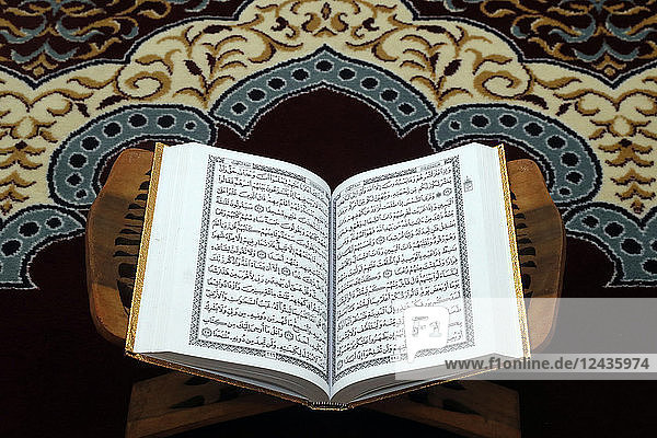 An open Holy Quran on wood stand  Hanoi  Vietnam  Indochina  Southeast Asia  Asia