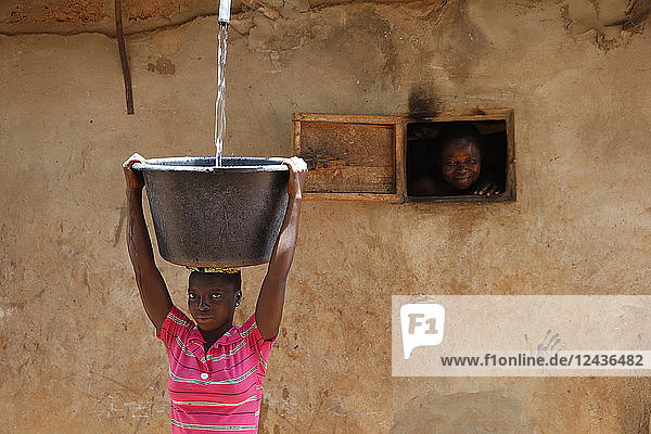 Collecting water in a Zou province village  Benin  West Africa  Africa