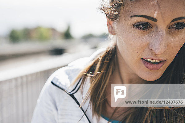 Portrait of sportive young woman outdoors