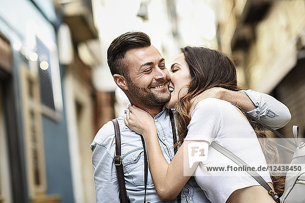Affectionate happy tourist couple exploring the city