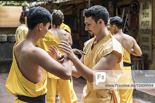 Vietnam Hanoi men exercising kung fu