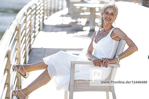 Senior woman relaxing on bench
