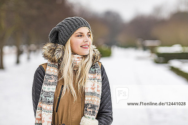 Portrait of smiling teenage girl in winter