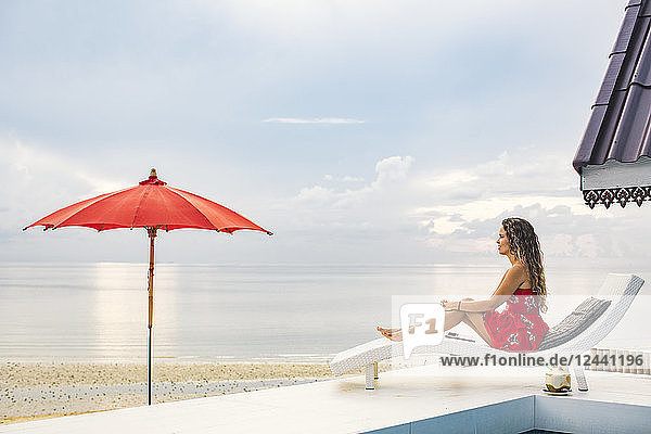 Thailand  Koh Phangan  woman relaxing near the beach