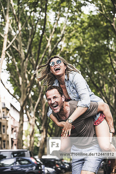 Portrait of carefree couple having fun outdoors