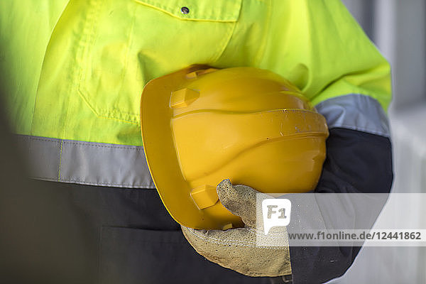 South Africa  Cape Town  Builder holding hard hat