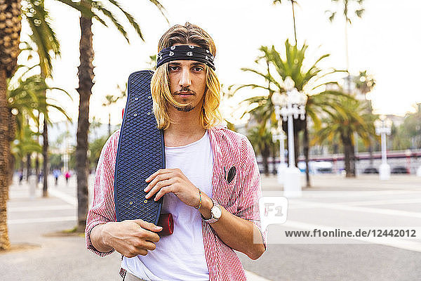 Portrait of serious skateboarder