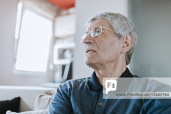 Senior man with hearing aid