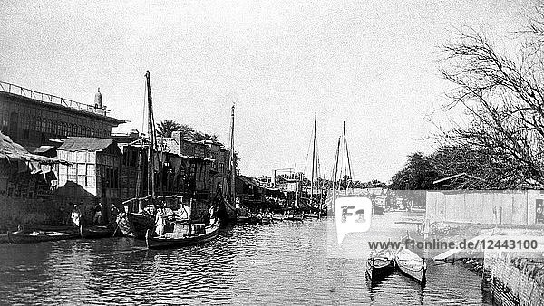WW1 photographs in Iraq ( Mesopotamia ) and surrounding area’s. The river Amara front  Ashar Creek Amara with boats people and buildings.