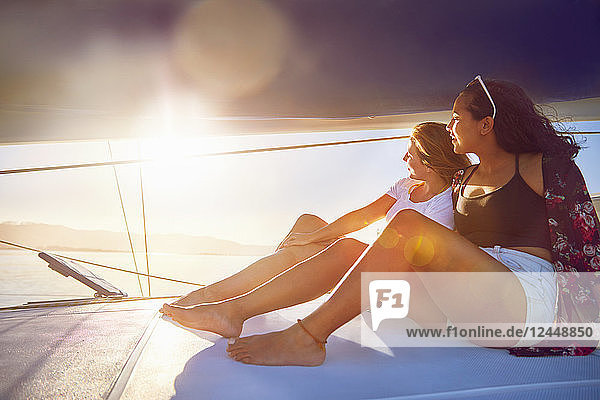 Young women relaxing on sunny boat