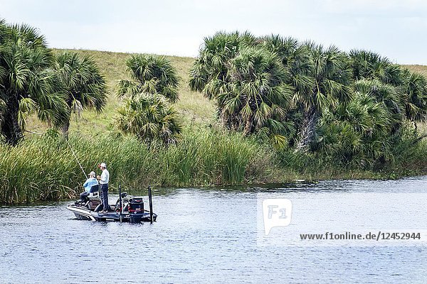 Florida  Lake Okeechobee  Herbert Hoover Dike  bass boat  fishing  levee  flood control  water conservation  man