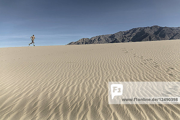 A Person Running In Desert Landscape In Death Valley Of California  Usa