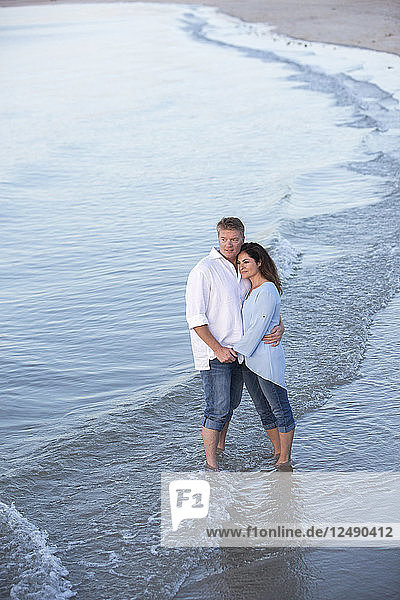 A couple are photographed at a Cape Cod beach.