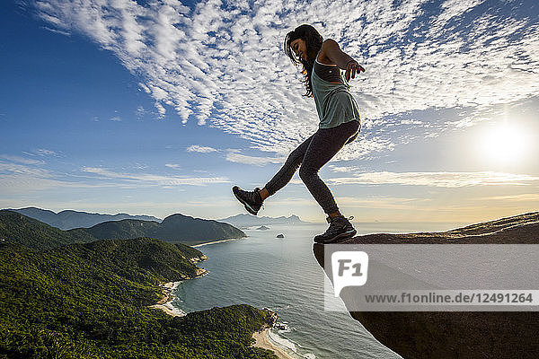 Woman on the edge of the mountain in Pedra do Tel?©grafo  Rio de Janeiro  Brazil
