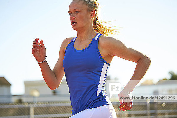 A Teenage Female Runner On The Track
