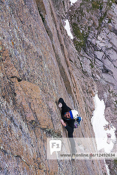 A man rock climbing a route called D7 on the East Face of Long's Peak  or the Diamond  Rocky Mountain National Park  Estes Park  Colorado.