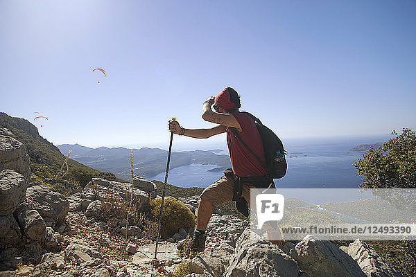 A Male Climber Exploring Paragliding During Mountain Trekking At Kas  Antalya  Turkey