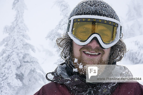 Portrait Of Male Snowboarder During A Snowstorm