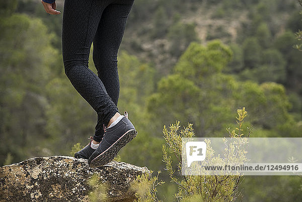 Female Hiker Standing On Rock In Forest Of Zaragoza  Spain