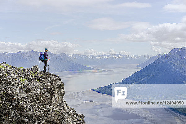 Female hiker at Hope Point in Chugach National Forest Alaska overlooking Turnagain Arm