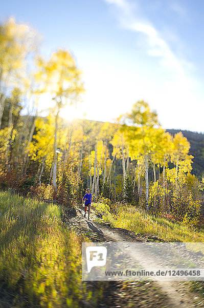 Woman running on a trail in Park City  Utah