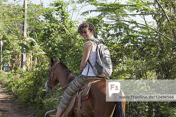 Girl Riding A Horse In Vinales Region In Cuba