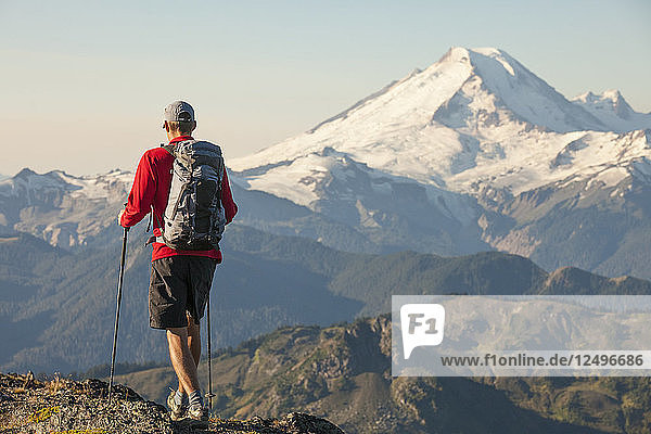 Man Hiking In North Cascades National Park With View Of Mount Baker