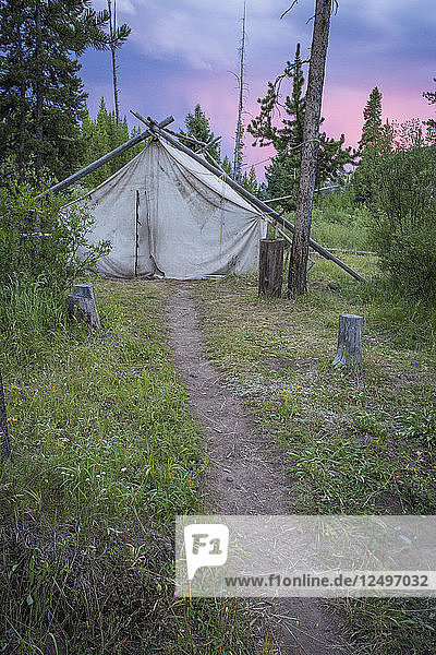 A Wall Tent With Pink Sunset In Background In Montana