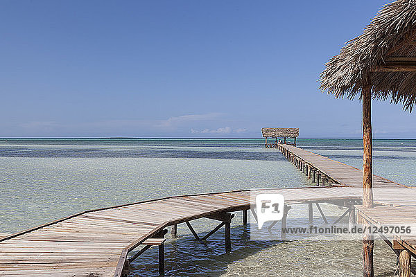 Wooden jetty entering turquoise water with no people in Cayo Guillermo  Cuba
