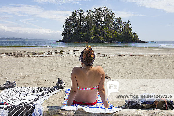 A Young Woman Relaxing On Beach Near Tofino  Vancouver Island  British Columbia