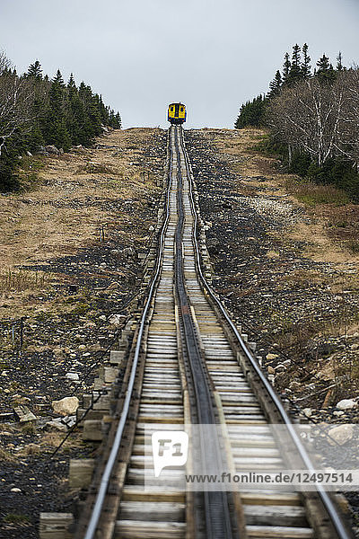 Train heading up the tracks toward the summit of Mount Washington.