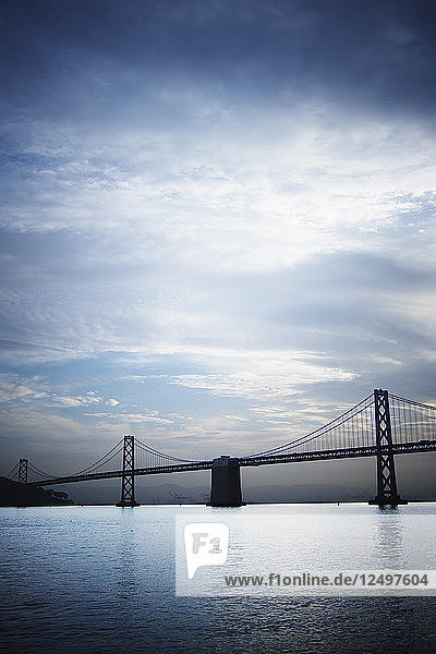 Scenic early morning view of the Oakland Bay Bridge crossing San Francisco Bay.