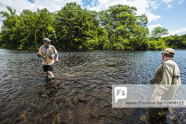 Two Fishermen Fly Fishing In Kennebec River