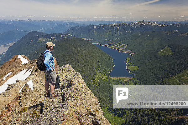 Hiker looking down on Jones Lake from top of Lady Peak in¬ÝCheam¬ÝMountain Range