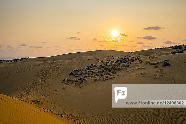 The sun sets over red sand dunes at M?©i N?© Phan Thi·?øt B?¨nh Thu·??n Province Vietnam