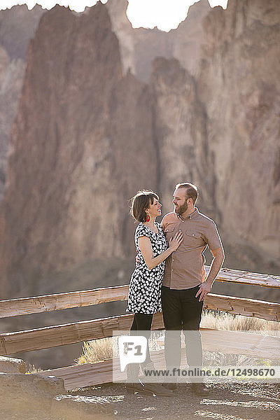 Lifestyle portrait of an engaged couple that loves the outdoors at Smith Rock State Park in Central Oregon.