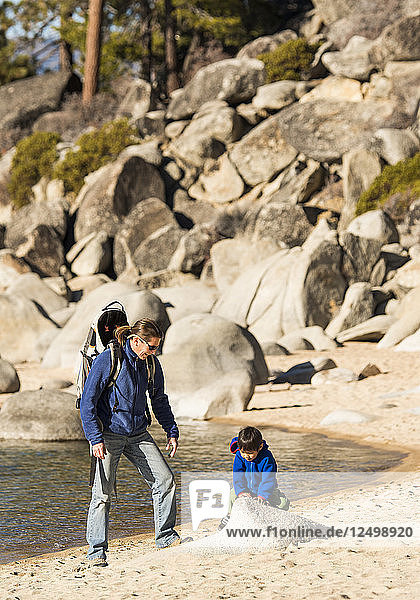 Mother and Son playing on beach at Lake Tahoe  Nevada