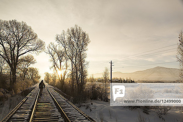 Greg Houska Walking The Railroad Track On The Way To Fly Fishing On The Provo River In Utah At Sunrise