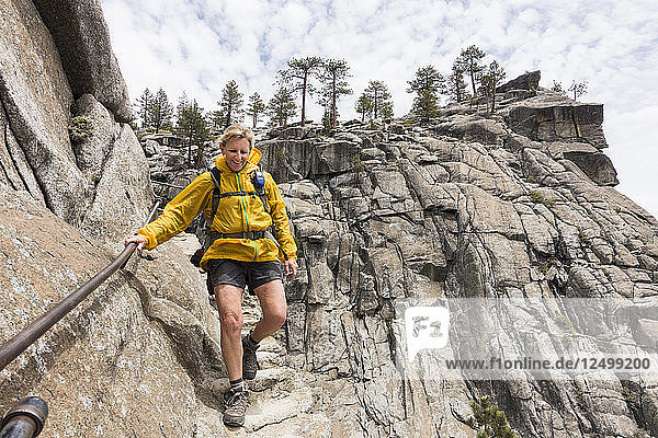 Female hiker descending to Yosemite Falls overlook  Yosemite National Park