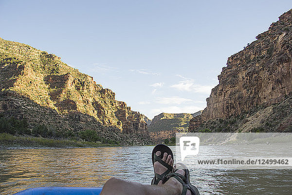 Relaxing while rafting on the Green River through Desolation Canyon  Utah.