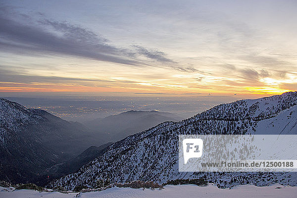 Setting sun over the Los Angeles Basin seen from Mt Baldy.