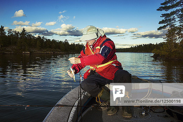 Fisherman Holds A Fish In His Hands On Nipissing Lake