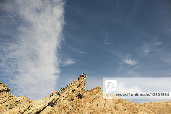 Visitors climb the slanted rock formations at Vasquez Rocks Natural Area Park in Agua Dulce  Calif.  on March 23  2014.