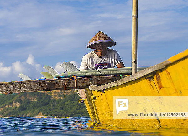 Asian man in boat.Bali.Indonesia.