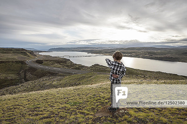 A Boy Pointing To The View Over The Columbia River In Washington  Usa