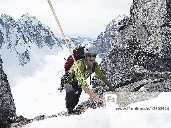 A Man Climbing On Middle Troll In Little Switzerland In Denali National Park