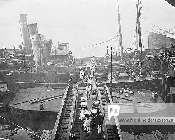 Unloading a fishing boat  Billingsgate market  London  1923. Artist: Unknown
