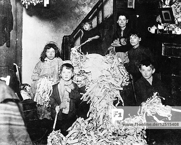 Making party streamers at home  London  c1900. Artist: Unknown