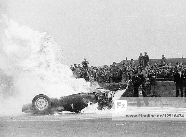 Tony Brooks car on fire at the British Grand Prix  Silverstone  Northamptonshire 1956. Artist: Unknown