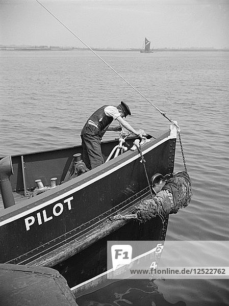 A man working on the bow of a River Thames pilot boat  c1945-c1965. Artist: SW Rawlings